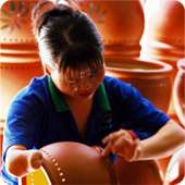 “A hard Living, Day Work” - Vietnamese woman who is missing part of her right hand earns a living making ceramic products in Binhduong province, Viet Nam.